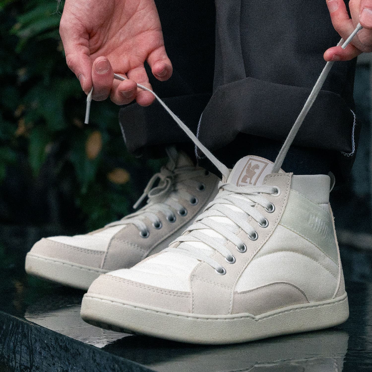 Foster High Tops in Cloud laces being tied