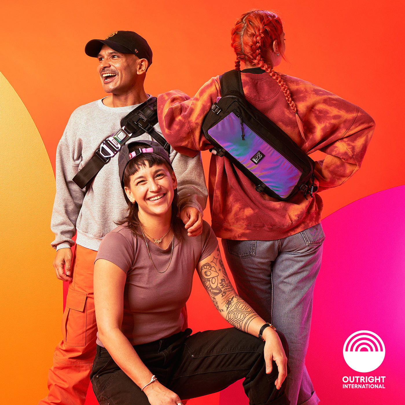 Gays Okay crew wearing the collection of Rainbow Reflective