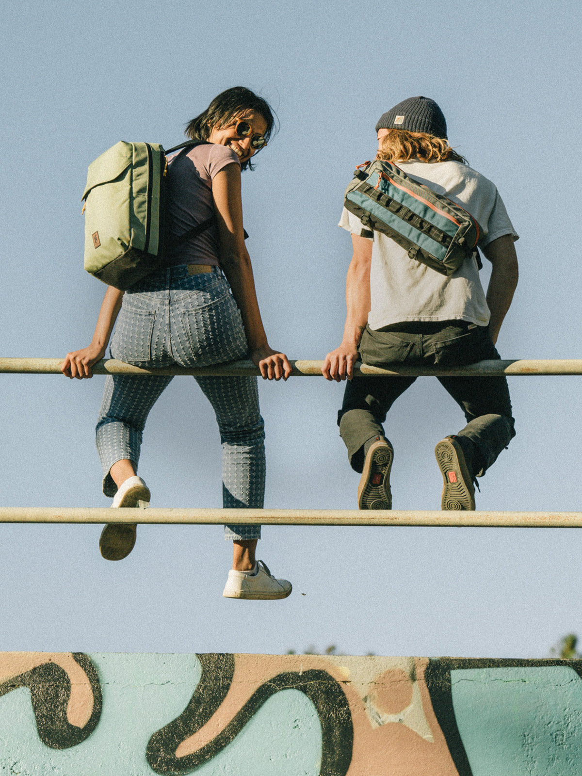 Careers banner two people sitting on a fence wearing their Chrome Packs mobile size