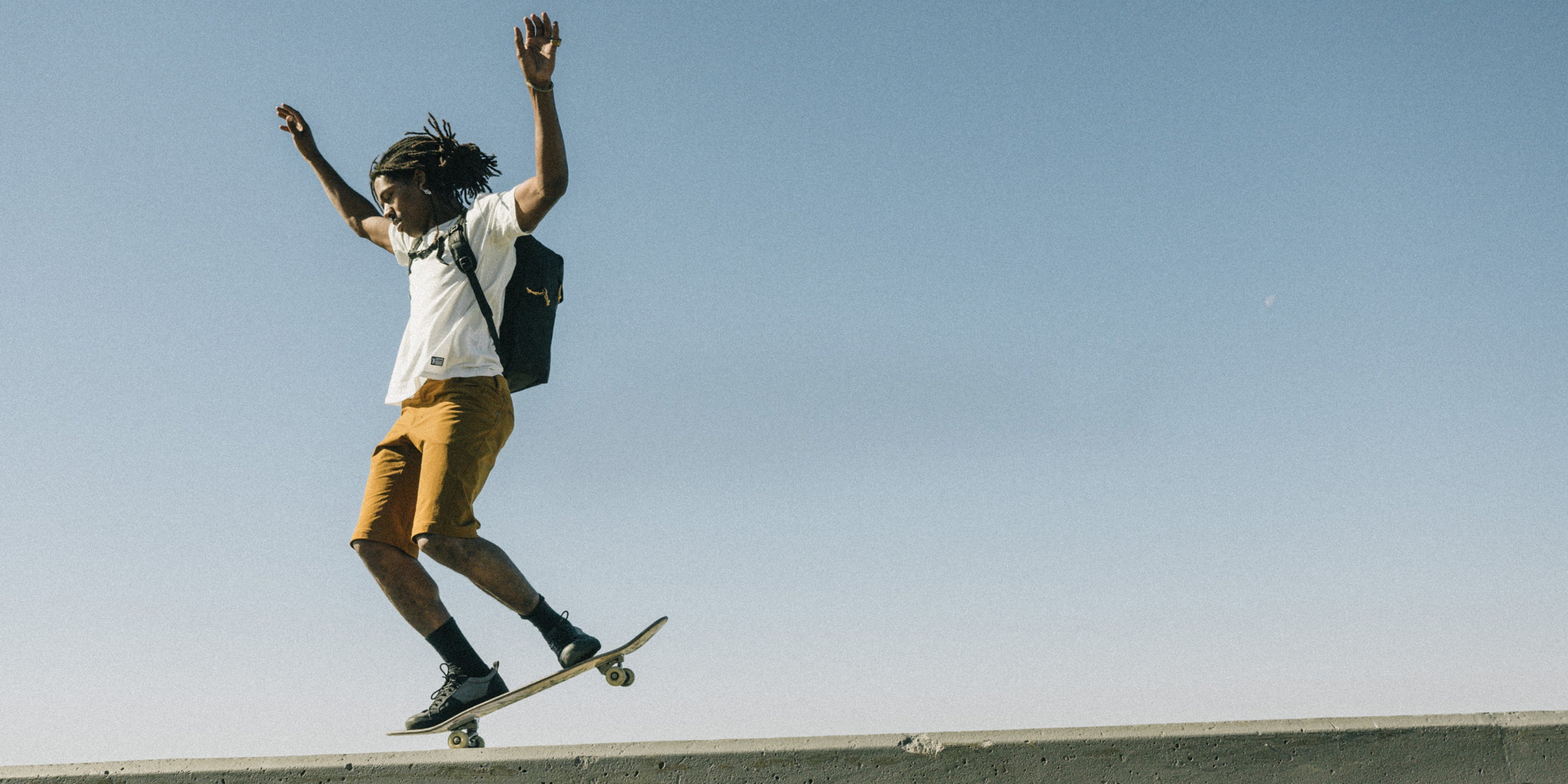 Person on a skateboard jumping desktop image for contact page